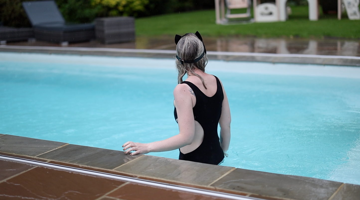 Tight Black Dress & Fishnets In Pool