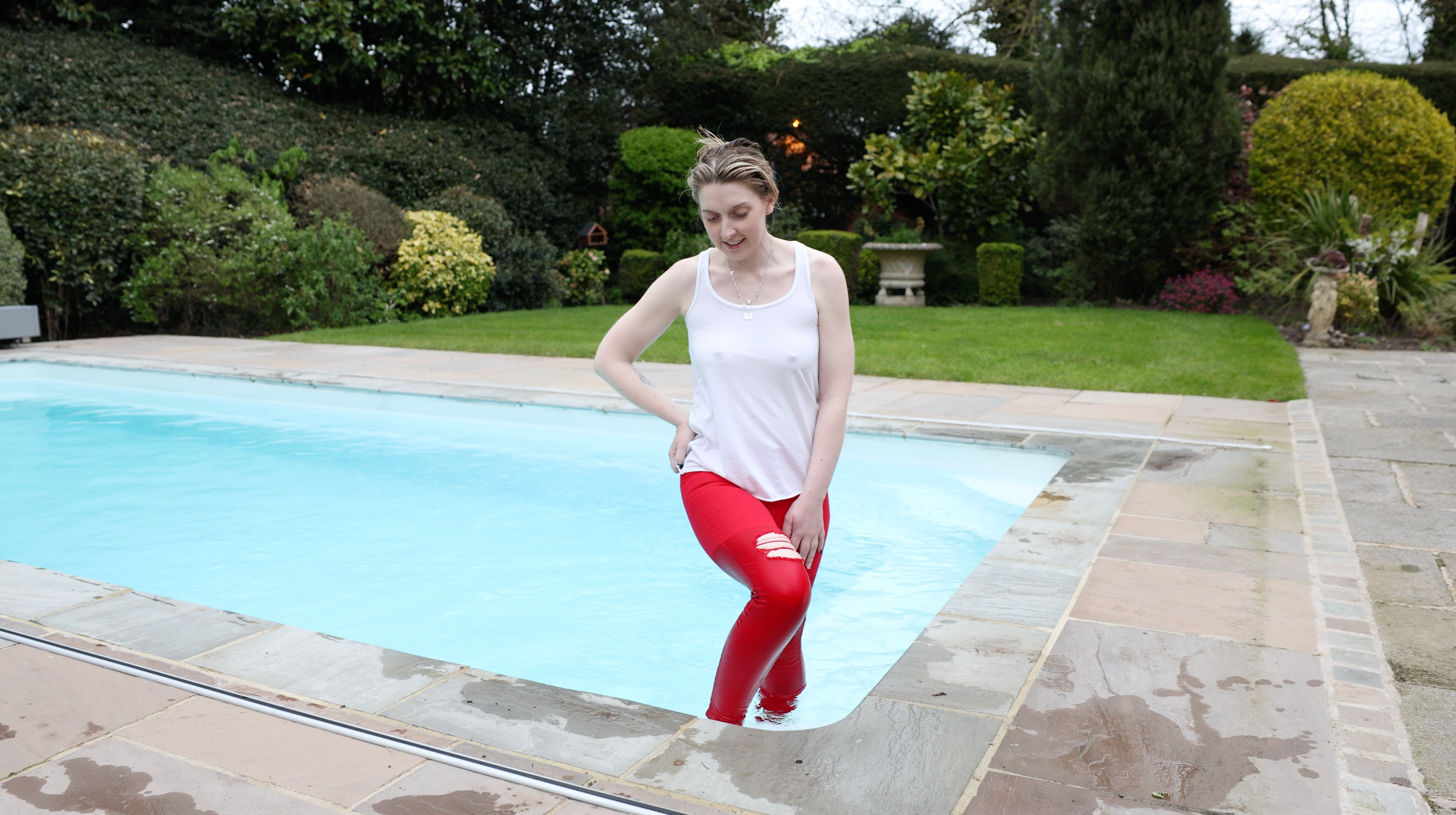 Red jeans and White Tank Top In Pool & Hottub