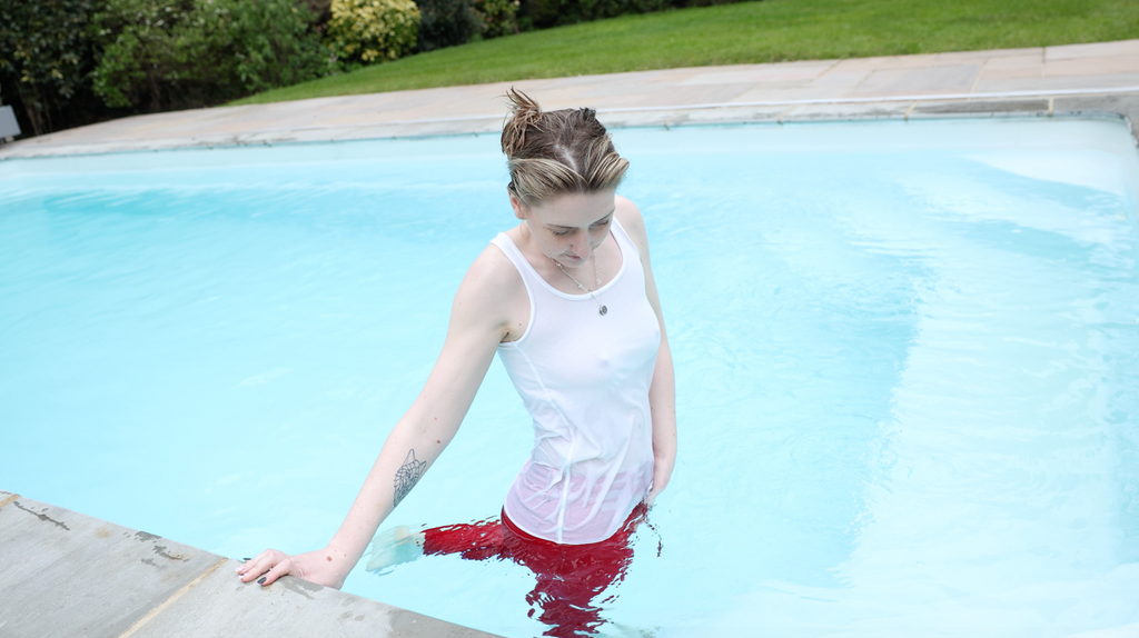 Red jeans and White Tank Top In Pool & Hottub