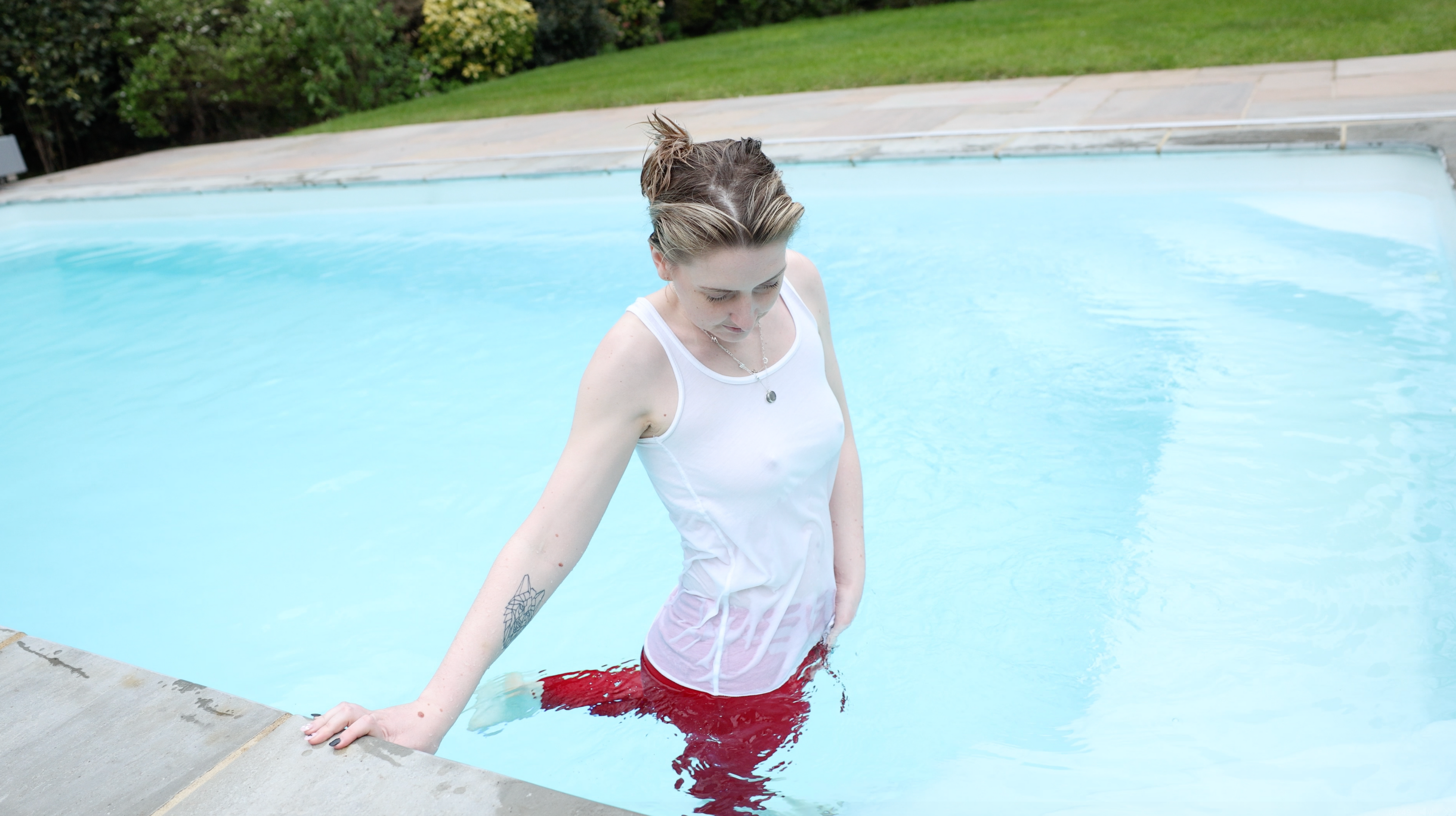 Red jeans and White Tank Top In Pool & Hottub